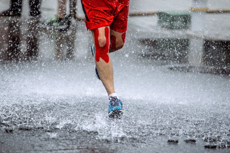 Runner on wet road
