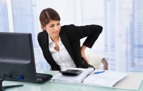 Woman at desk with back pain