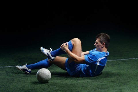 Soccer player with sports injury