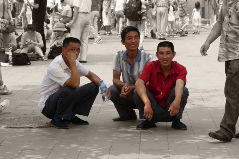 3 people performing deep squat